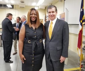 Emergency Grant recipient, Erica Ways with Governor Cooper