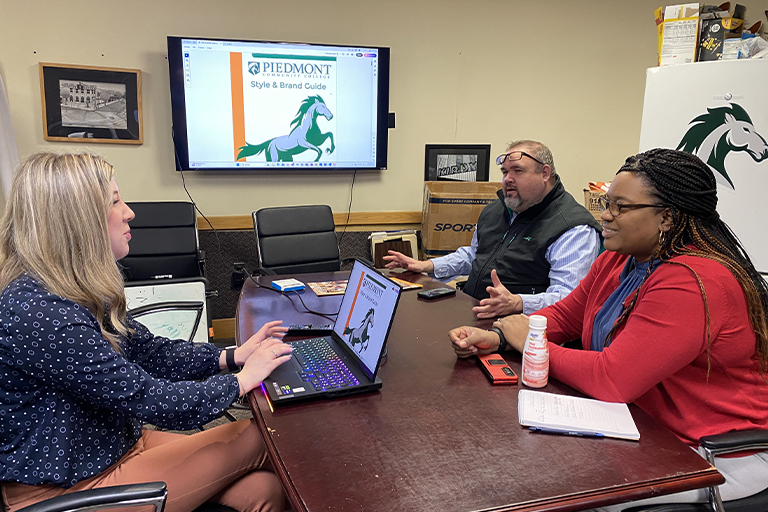 PCC staff in a work meeting.