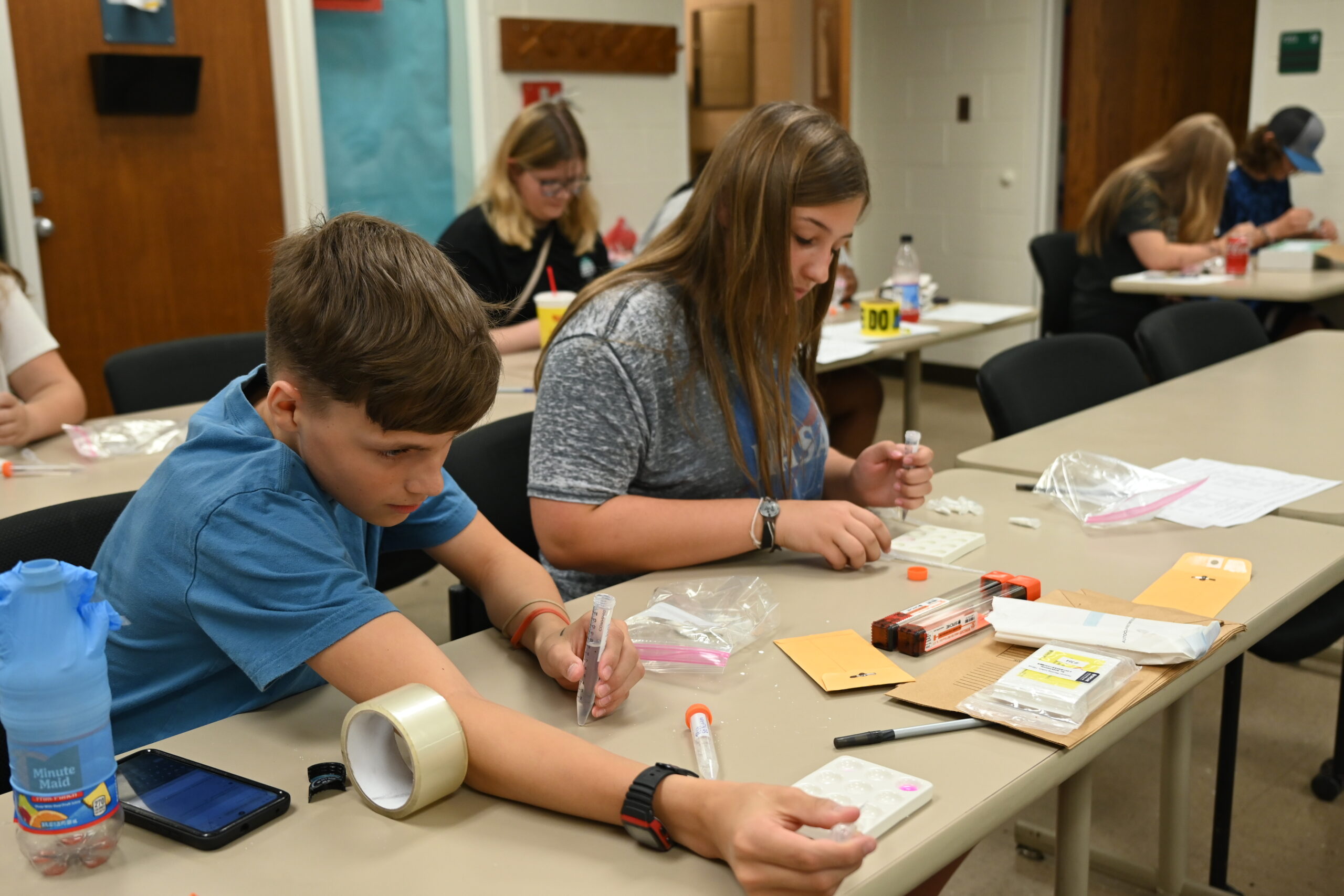 Campers in 2024 Crime Busters camp putting their detective skills to work.