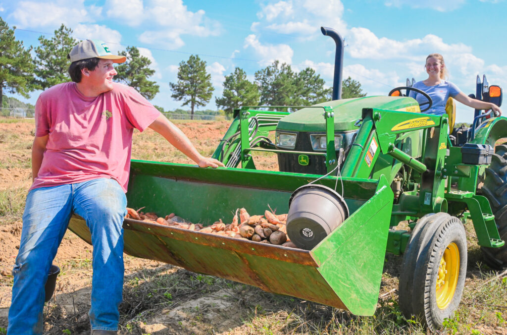 PCC student sitting on tractor.