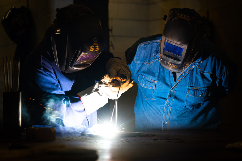 Campers working in welding shop during 2024 summer camp.