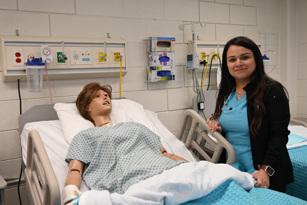 Hispanic student in PCC nursing simulation lab.