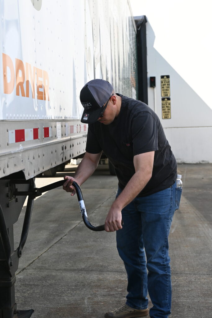 PCC Commercial Drivers License (CDL) student lowering trailer.