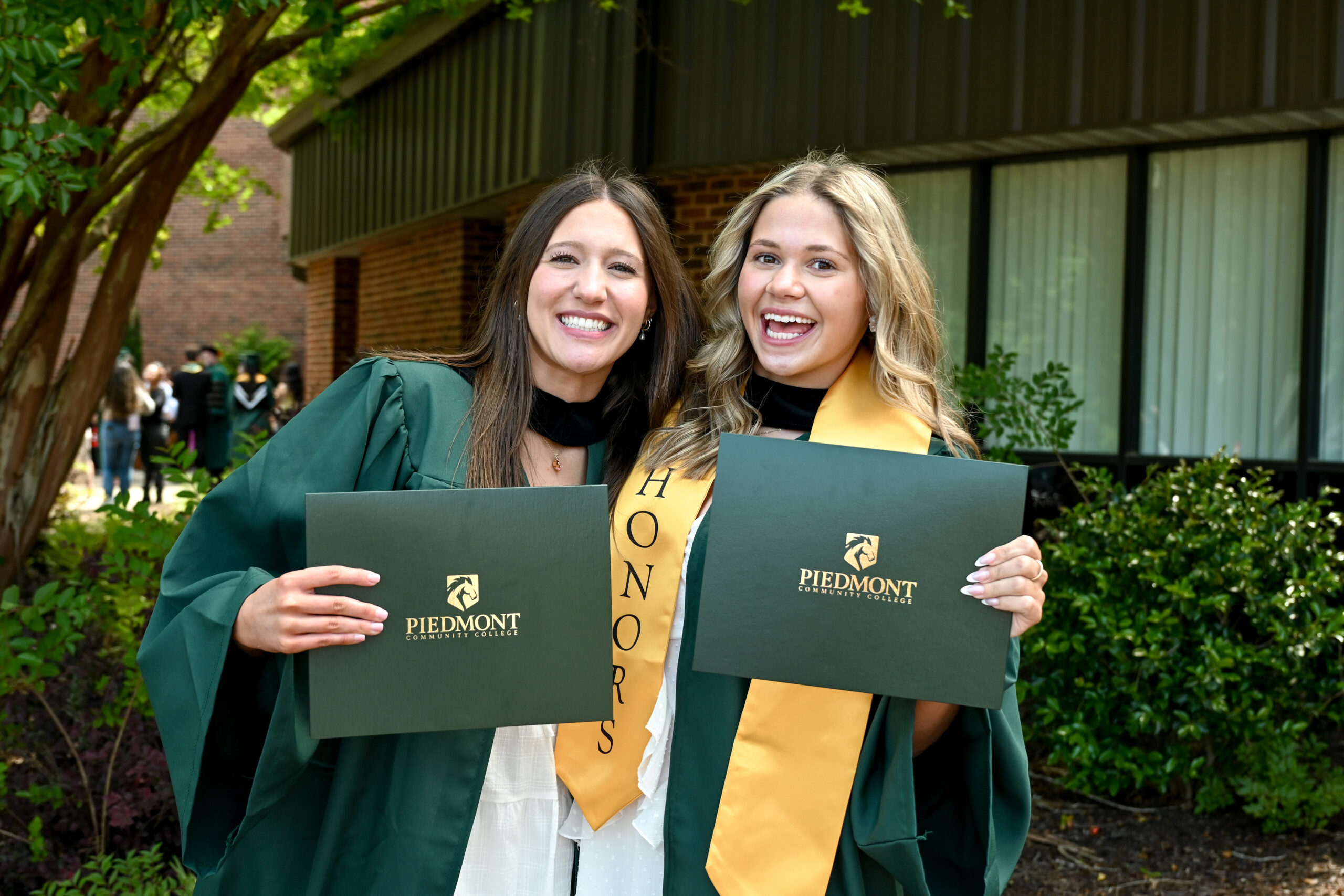 PCC students celebrating after graduation
